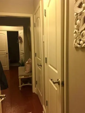 a view of a bedroom from a hallway