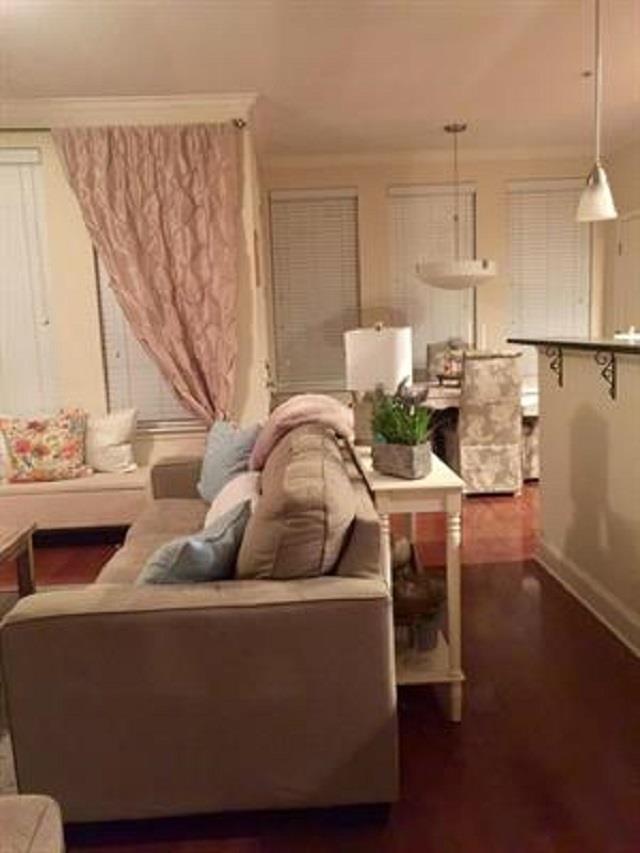 70 West Carolina Avenue, Unit 105 Memphis, TN 38103 - Photo 30 of 40 a living room with furniture and a chandelier