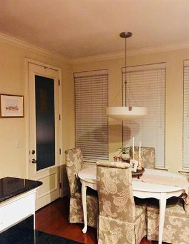 70 West Carolina Avenue, Unit 105 Memphis, TN 38103 - Photo 34 of 40 a view of a dining room with furniture and wooden floor
