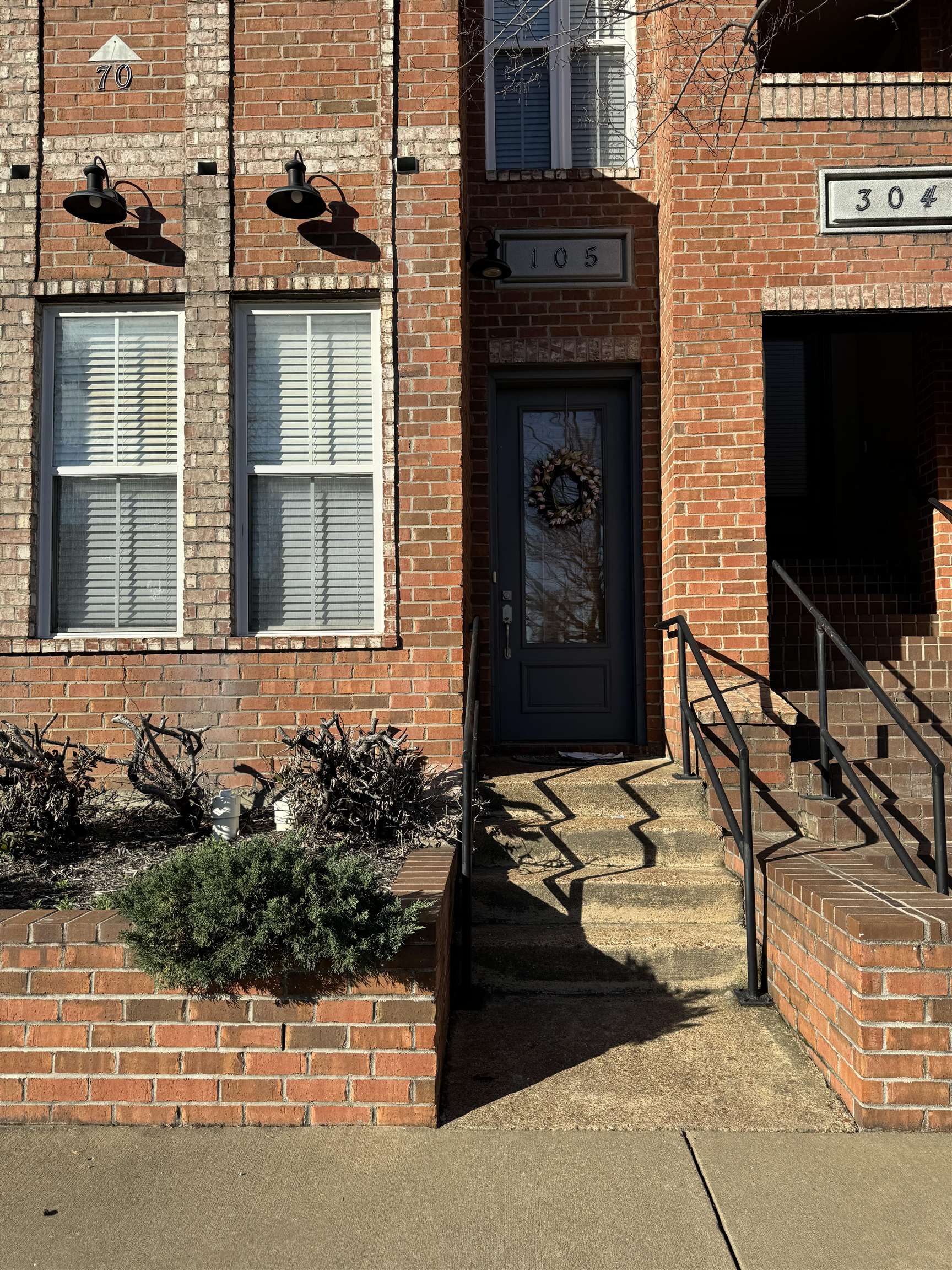 70 West Carolina Avenue, Unit 105 Memphis, TN 38103 - Photo 40 of 40 a front view of a house with a yard