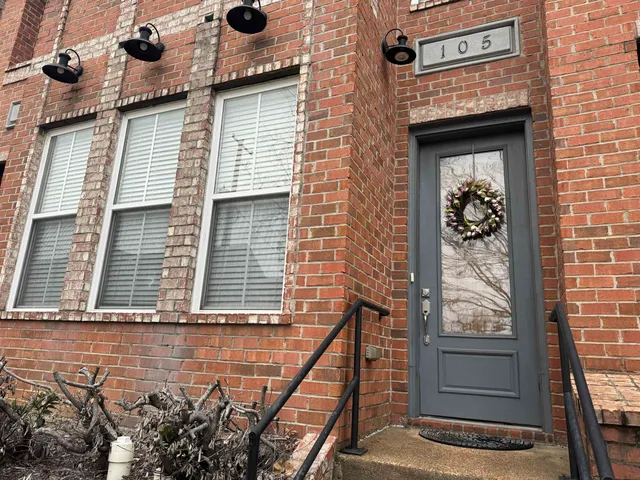 a front view of a house with stairs