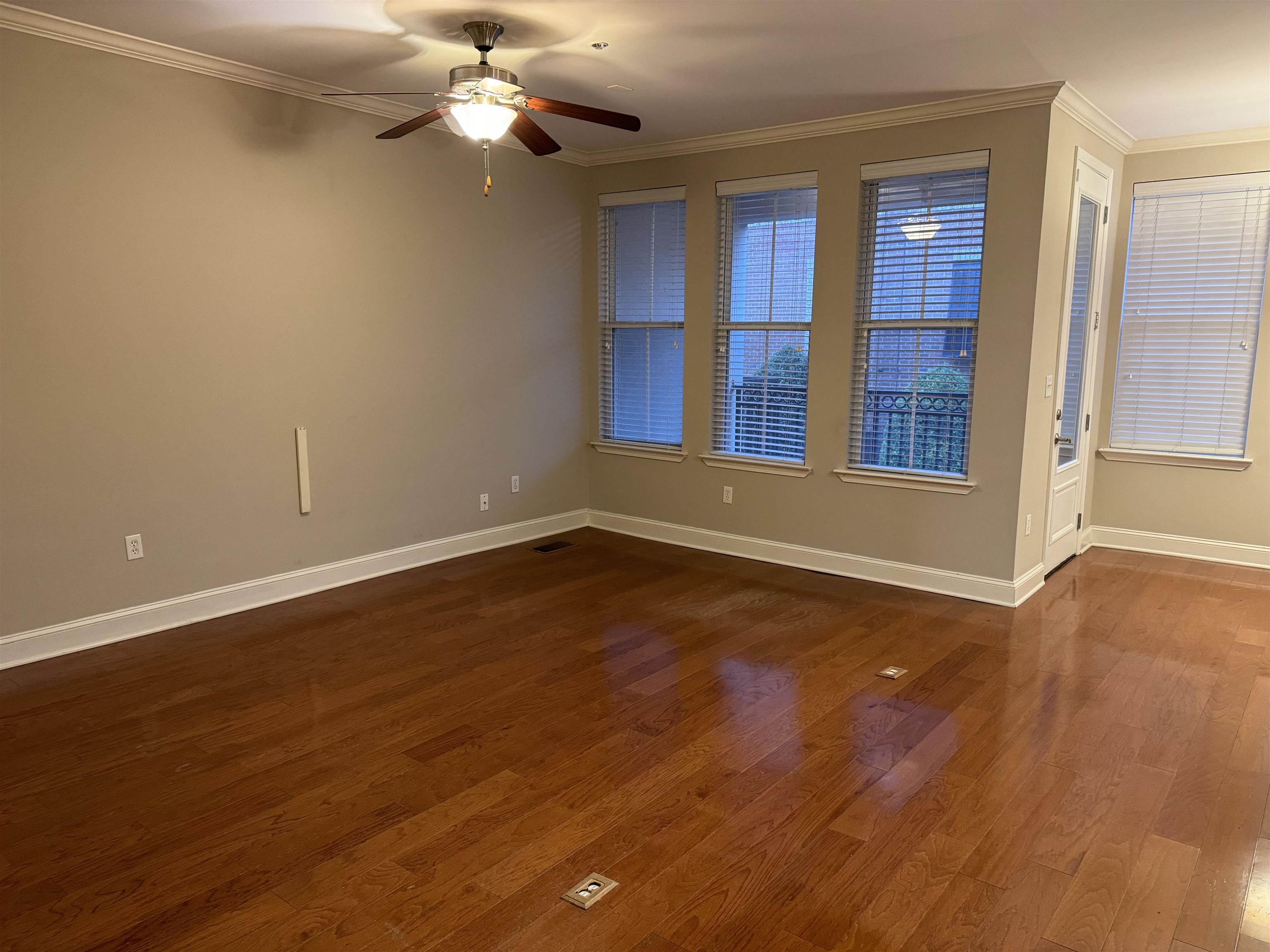 70 West Carolina Avenue, Unit 105 Memphis, TN 38103 - Photo 7 of 40 a view of empty room with wooden floor and fan