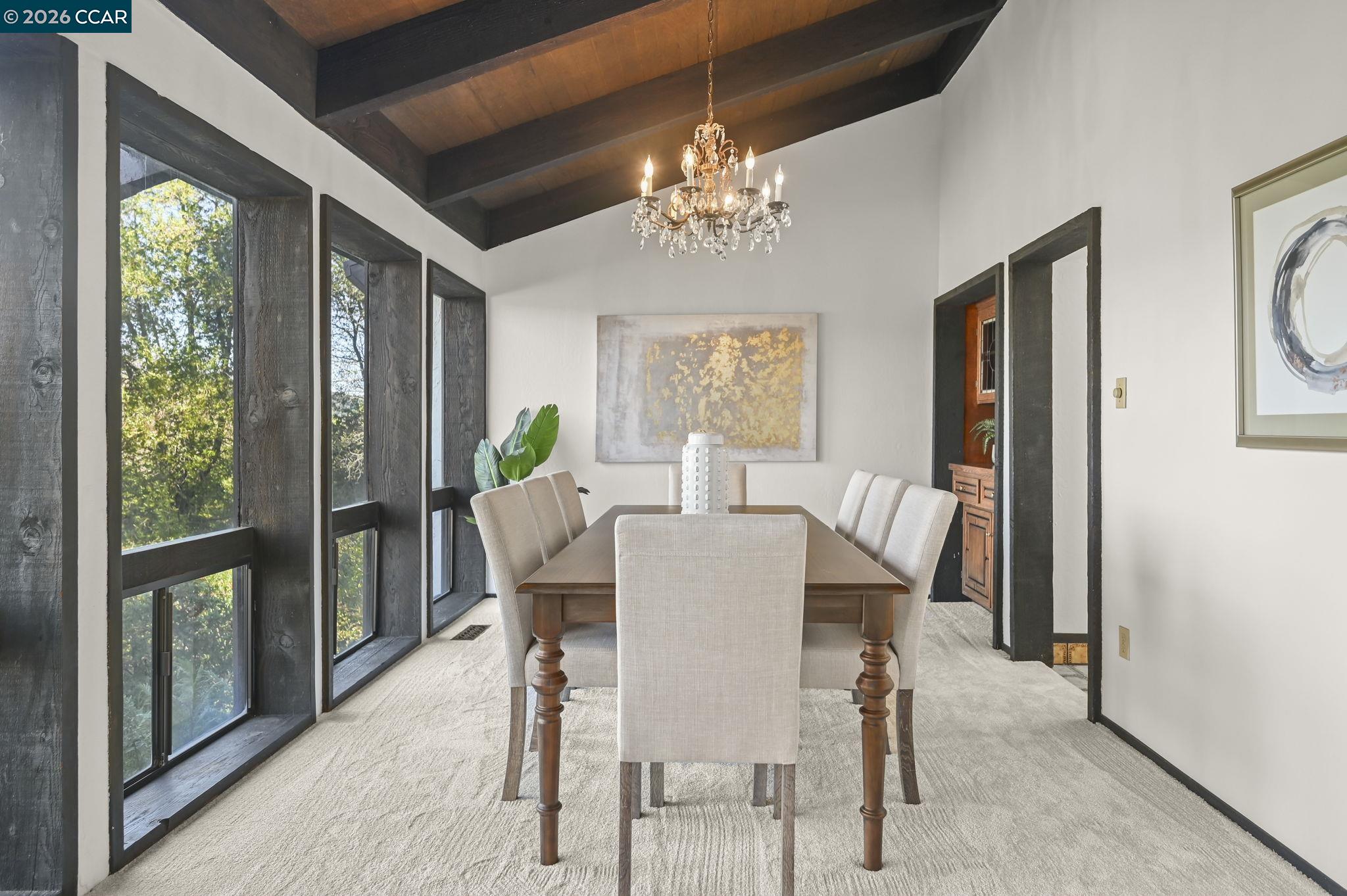 3912 Quail Ridge Road Lafayette, CA 94549 - Photo 11 of 60 a view of a dining room with furniture a chandelier and wooden floor