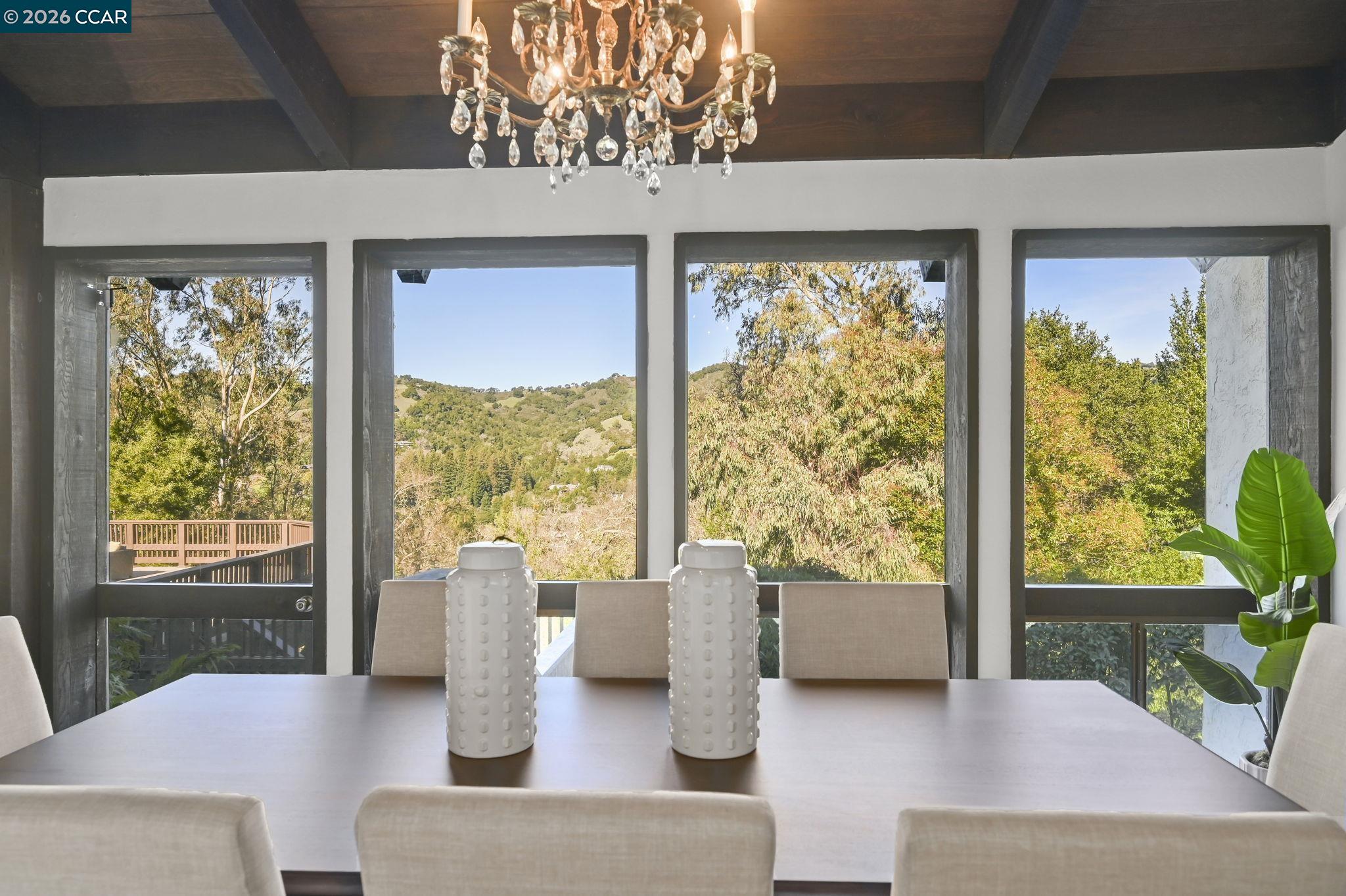 3912 Quail Ridge Road Lafayette, CA 94549 - Photo 12 of 60 a living room with couches and a dining table with garden view