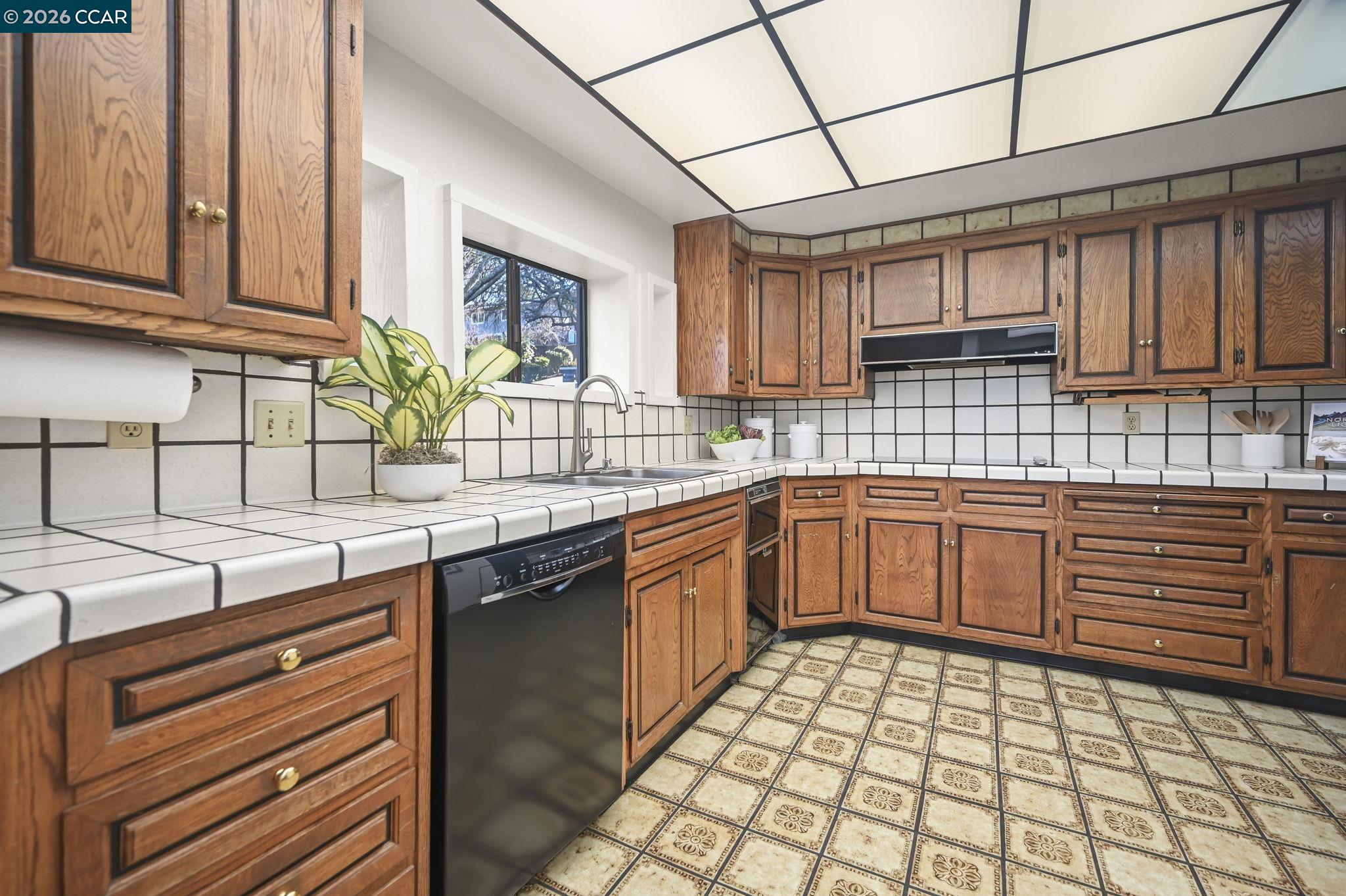 3912 Quail Ridge Road Lafayette, CA 94549 - Photo 13 of 60 a kitchen with stainless steel appliances granite countertop a sink and cabinets
