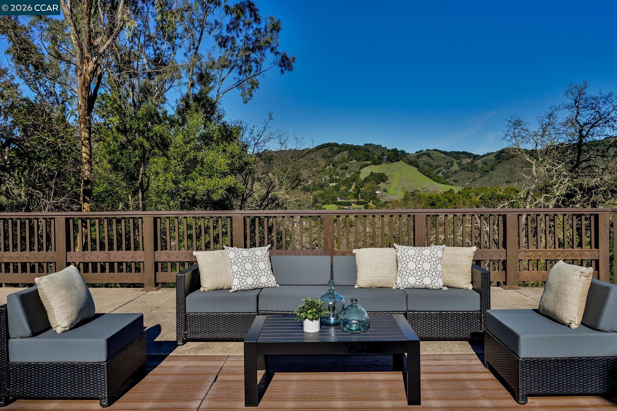 3912 Quail Ridge Road Lafayette, CA 94549 - Photo 24 of 60 a balcony with wooden floor and outdoor seating