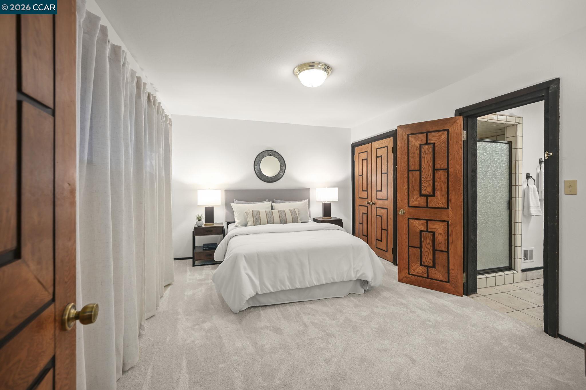 3912 Quail Ridge Road Lafayette, CA 94549 - Photo 34 of 60 a bedroom with a large bed and a closet