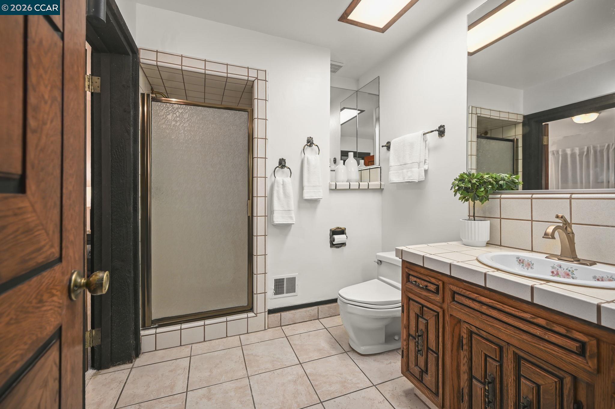 3912 Quail Ridge Road Lafayette, CA 94549 - Photo 35 of 60 a spacious bathroom with a sink toilet and shower