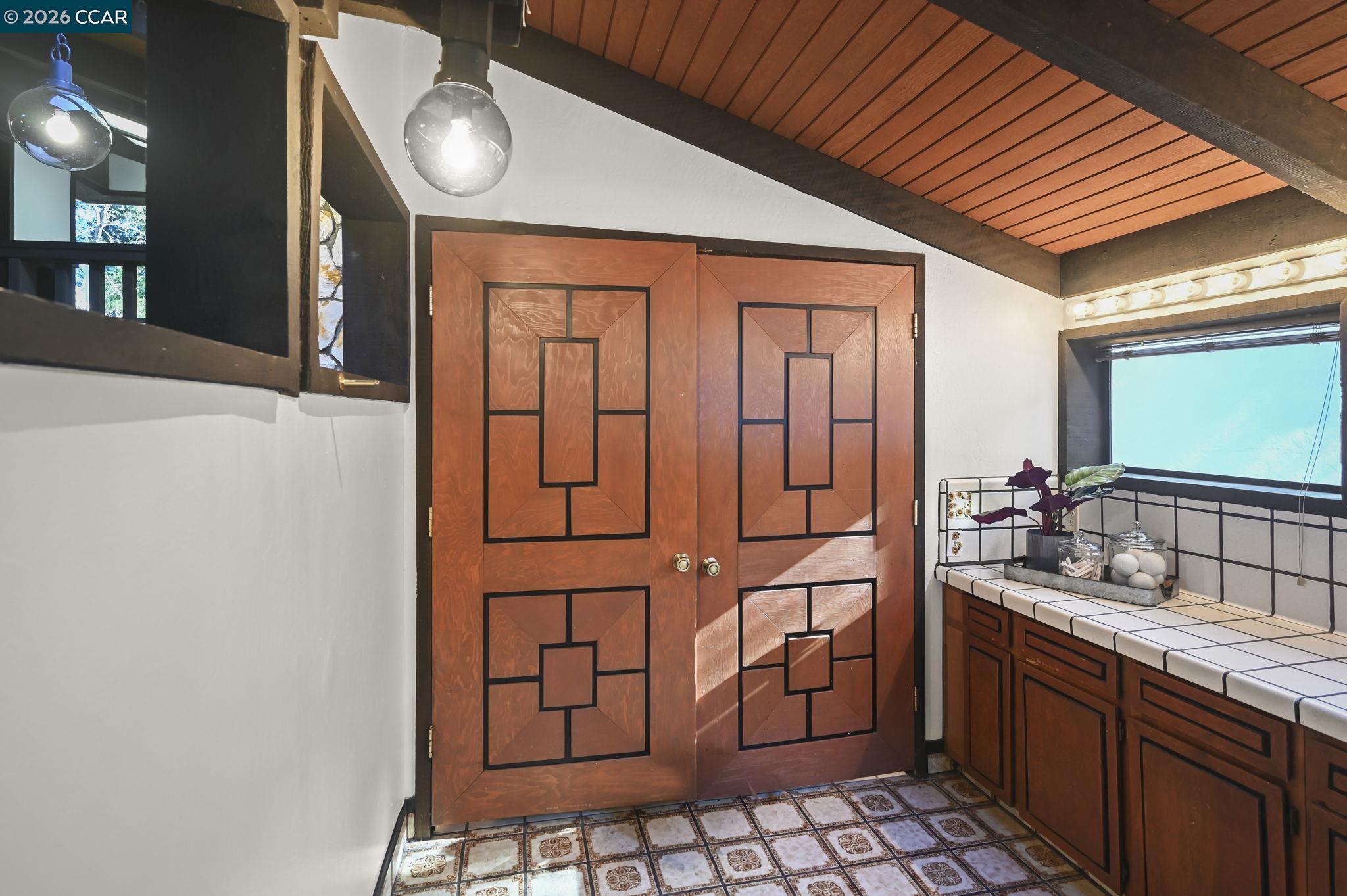 3912 Quail Ridge Road Lafayette, CA 94549 - Photo 38 of 60 a bathroom with a sink a mirror and shower