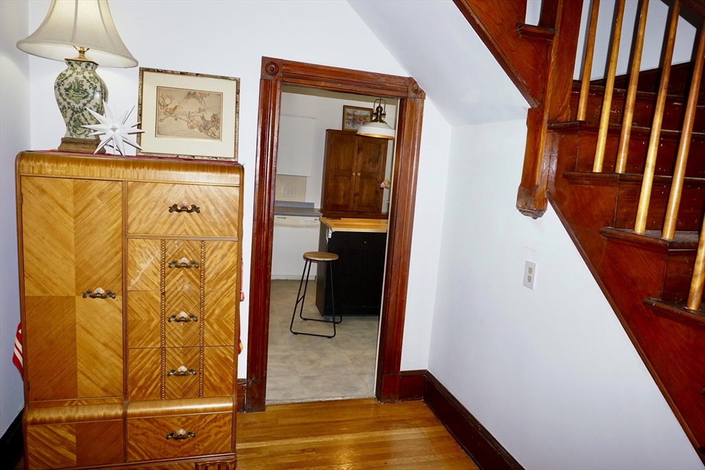 4 Carpenter Road Monson, MA 01057 - Photo 9 of 29 a view of a hallway with wooden floor and stairs