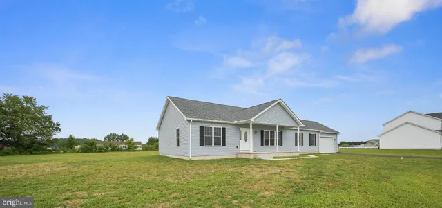 a house with river in front of it