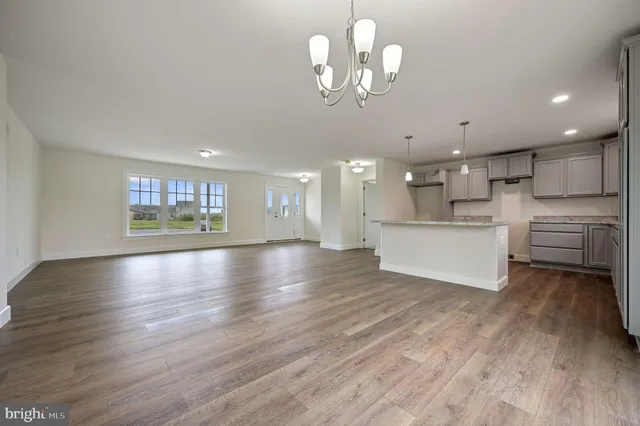a view of a kitchen with a dishwasher cabinets and wooden floor