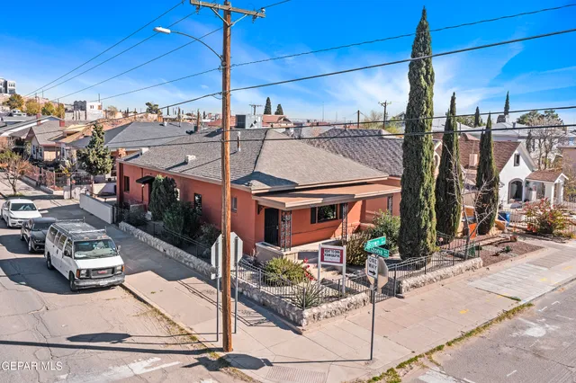 a view of a patio with table and chairs potted plants