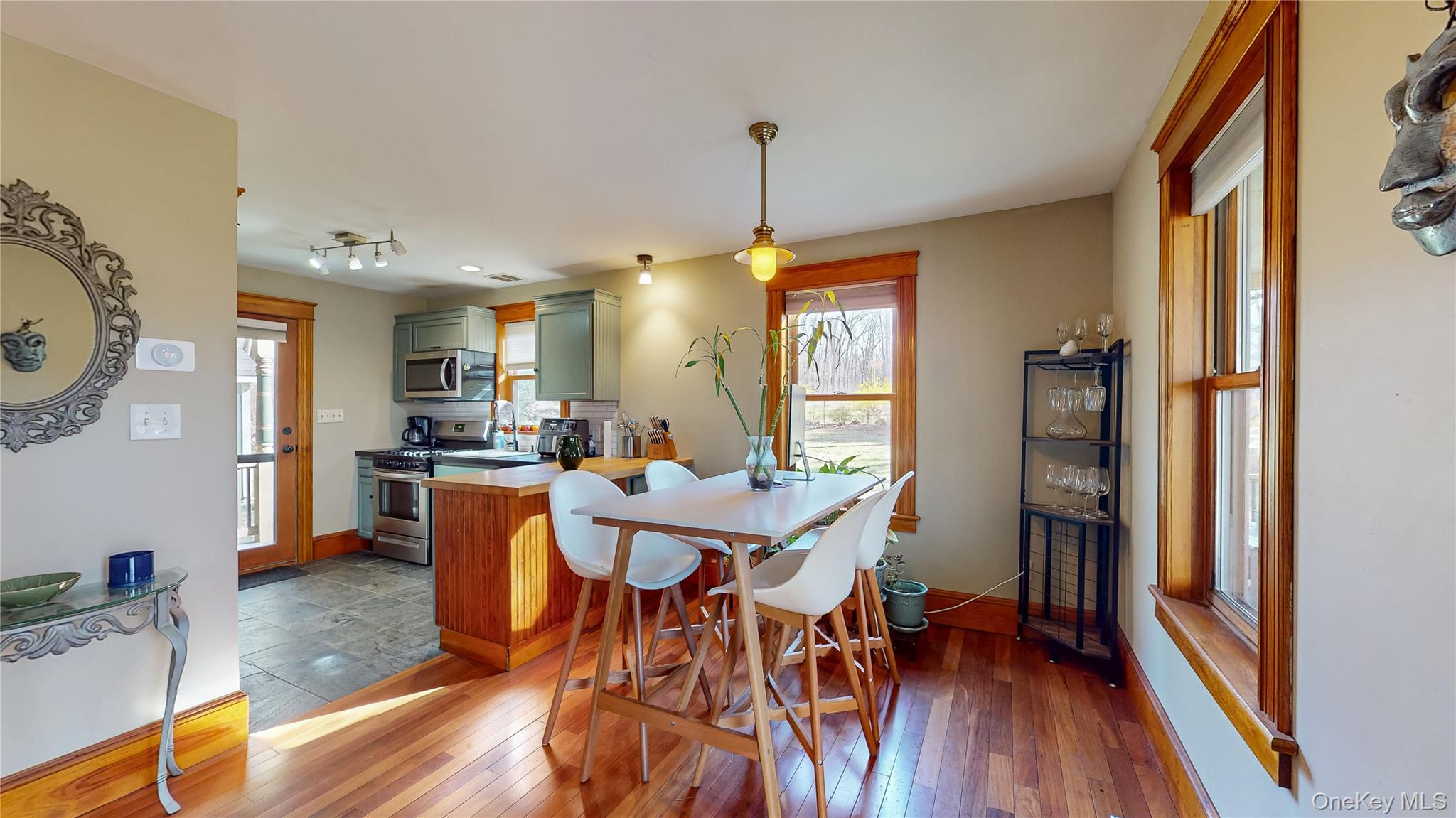 1193 S Road Wurtsboro, NY 12790 - Photo 14 of 41 a view of a dining room with furniture and wooden floor