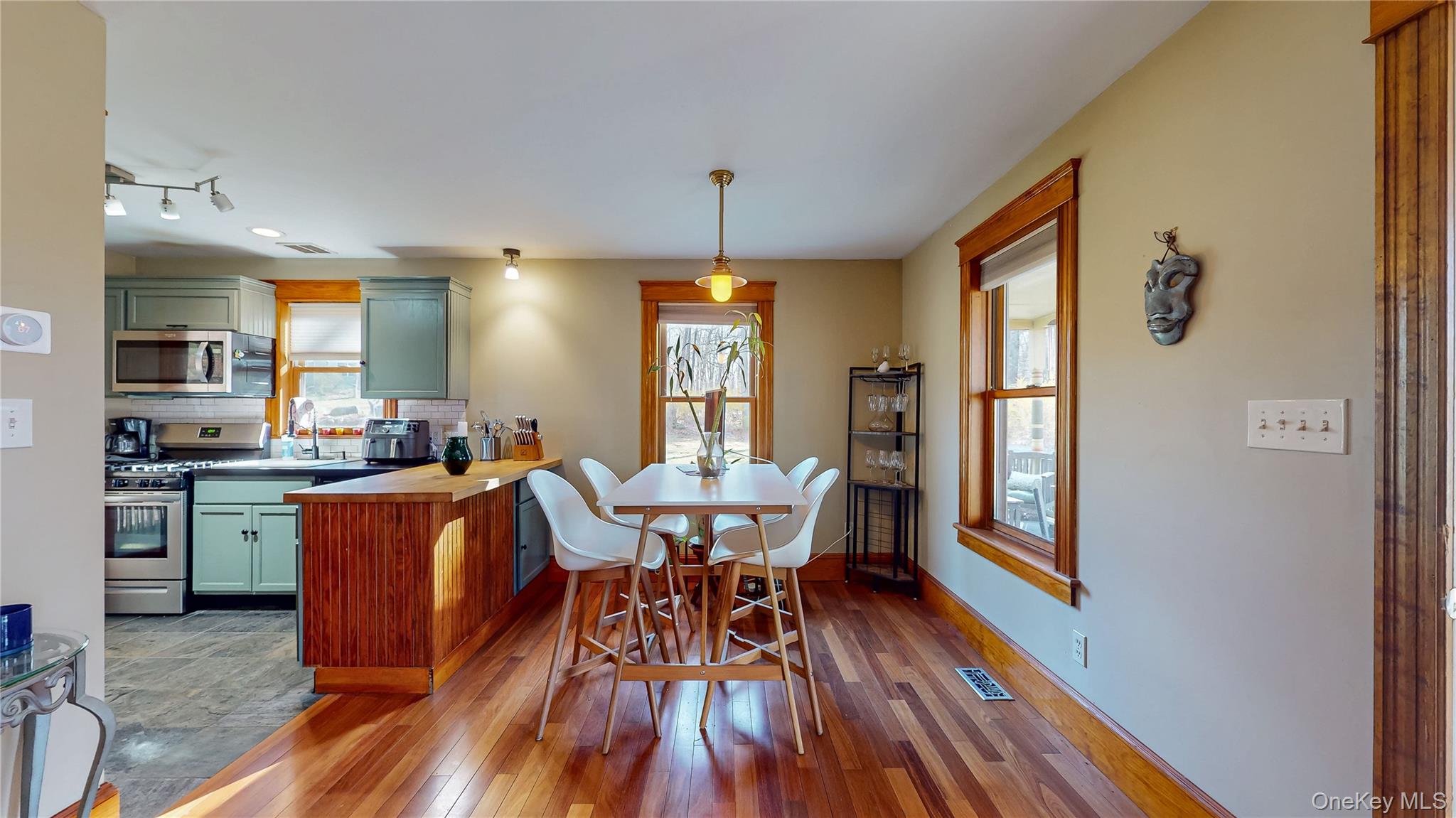 1193 S Road Wurtsboro, NY 12790 - Photo 15 of 41 a view of a dining room with furniture window and wooden floor