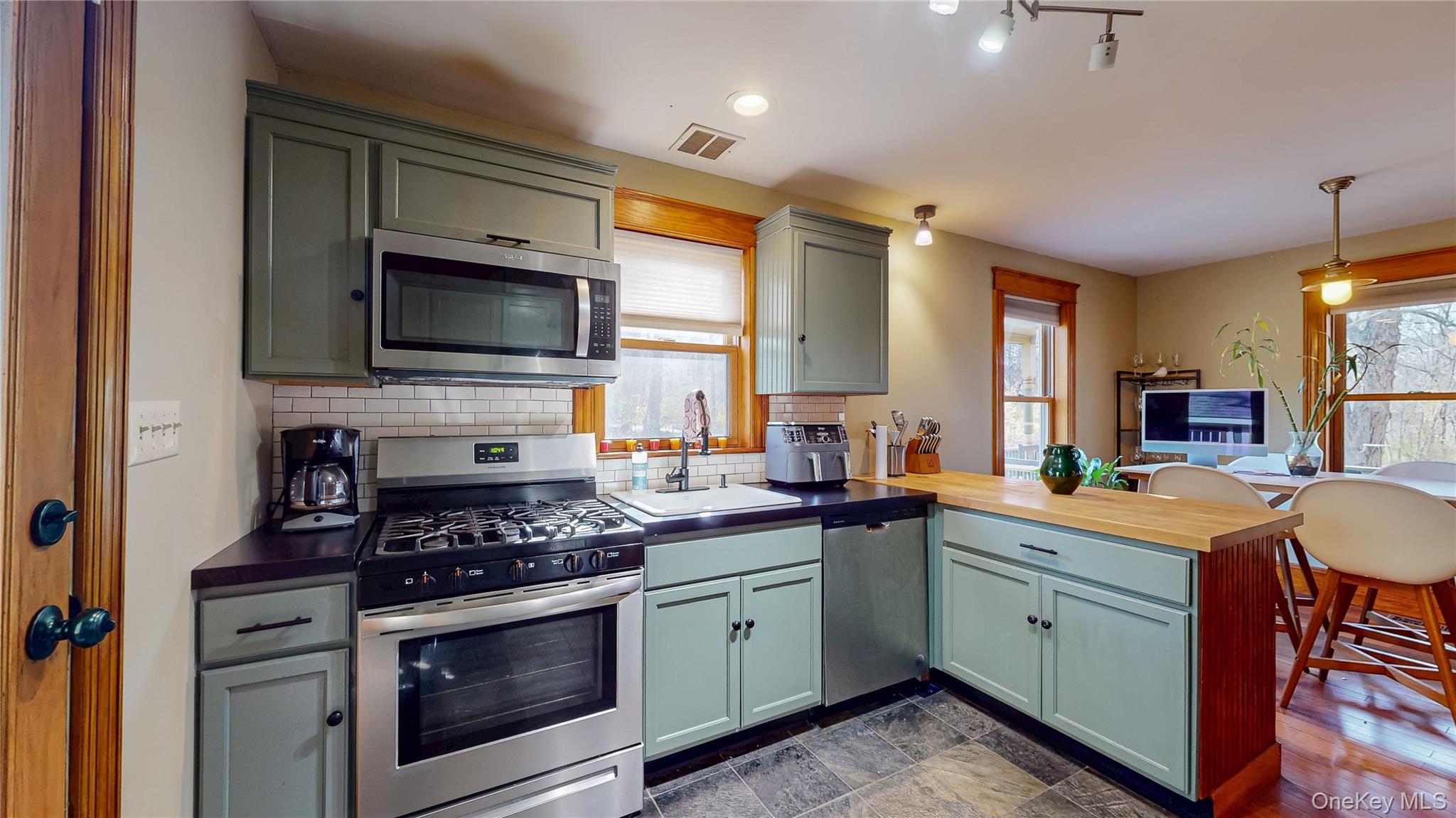 1193 S Road Wurtsboro, NY 12790 - Photo 18 of 41 a kitchen with a stove a sink and a microwave
