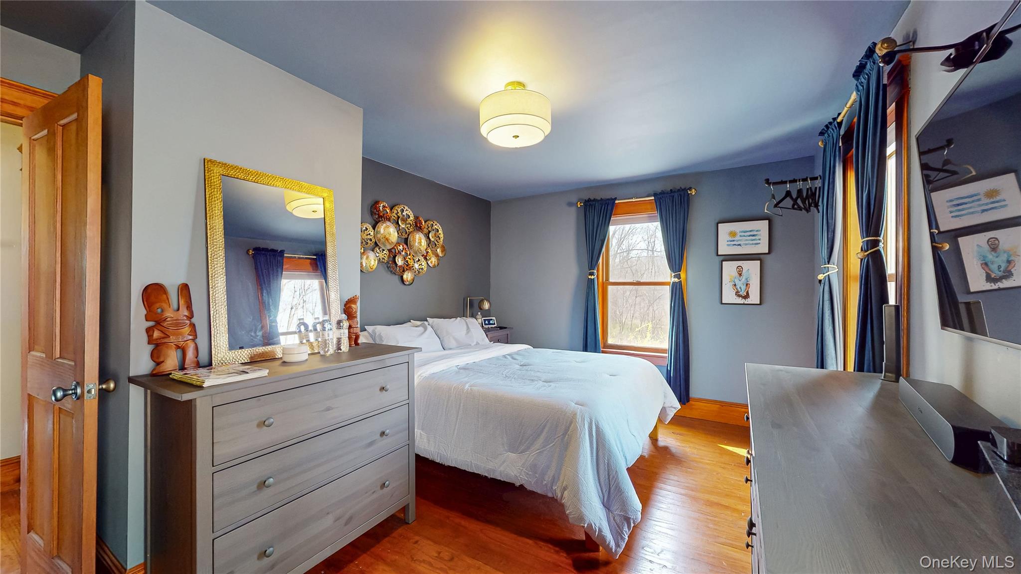1193 S Road Wurtsboro, NY 12790 - Photo 28 of 41 a bedroom with a bed and a mirror on dresser