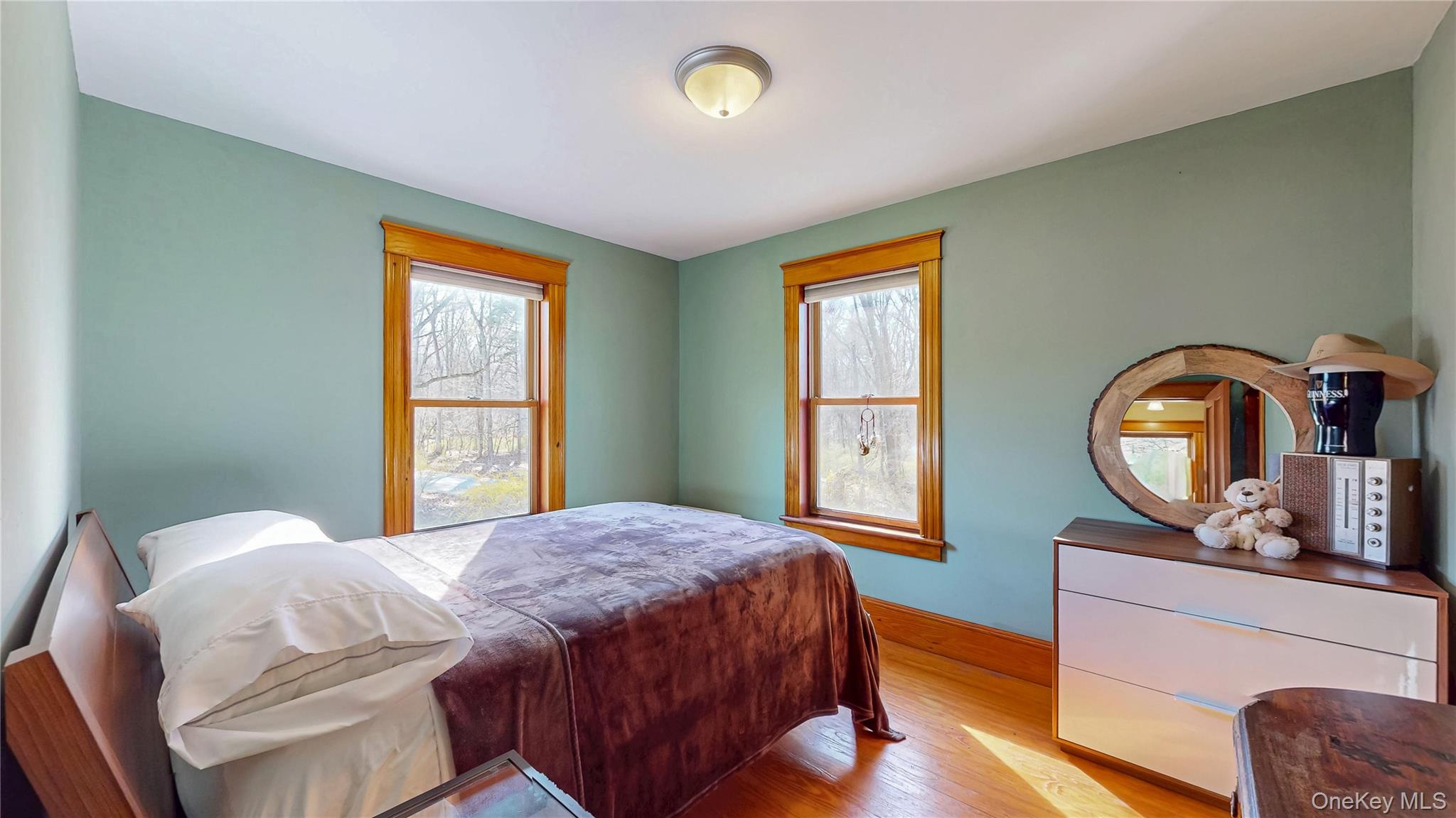 1193 S Road Wurtsboro, NY 12790 - Photo 30 of 41 a bedroom with a bed window and mirror