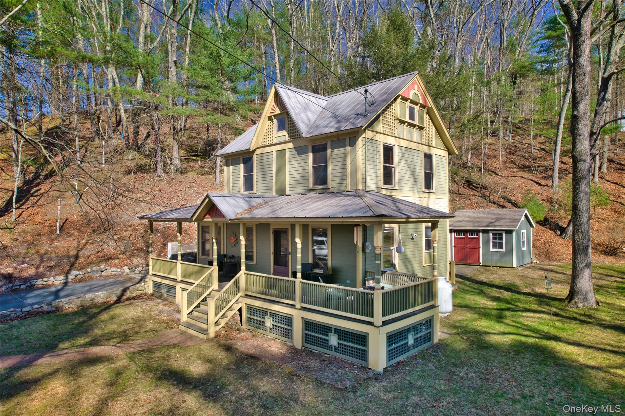 1193 S Road Wurtsboro, NY 12790 - Photo 3 of 41 a front view of a house with a yard table and chairs