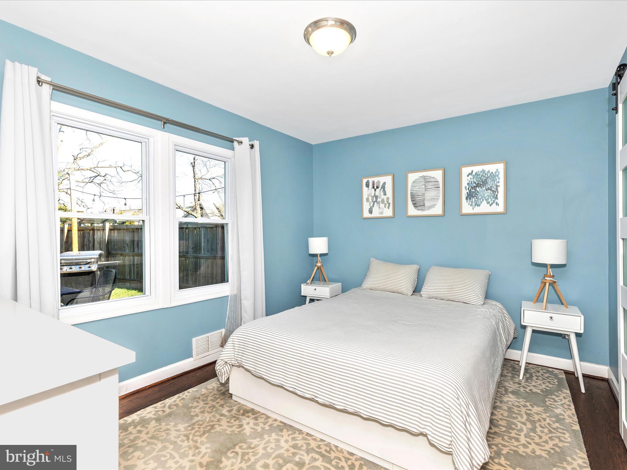 207 Thomas Avenue Frederick, MD 21701 - Photo 17 of 60 a bedroom with a large bed and a window