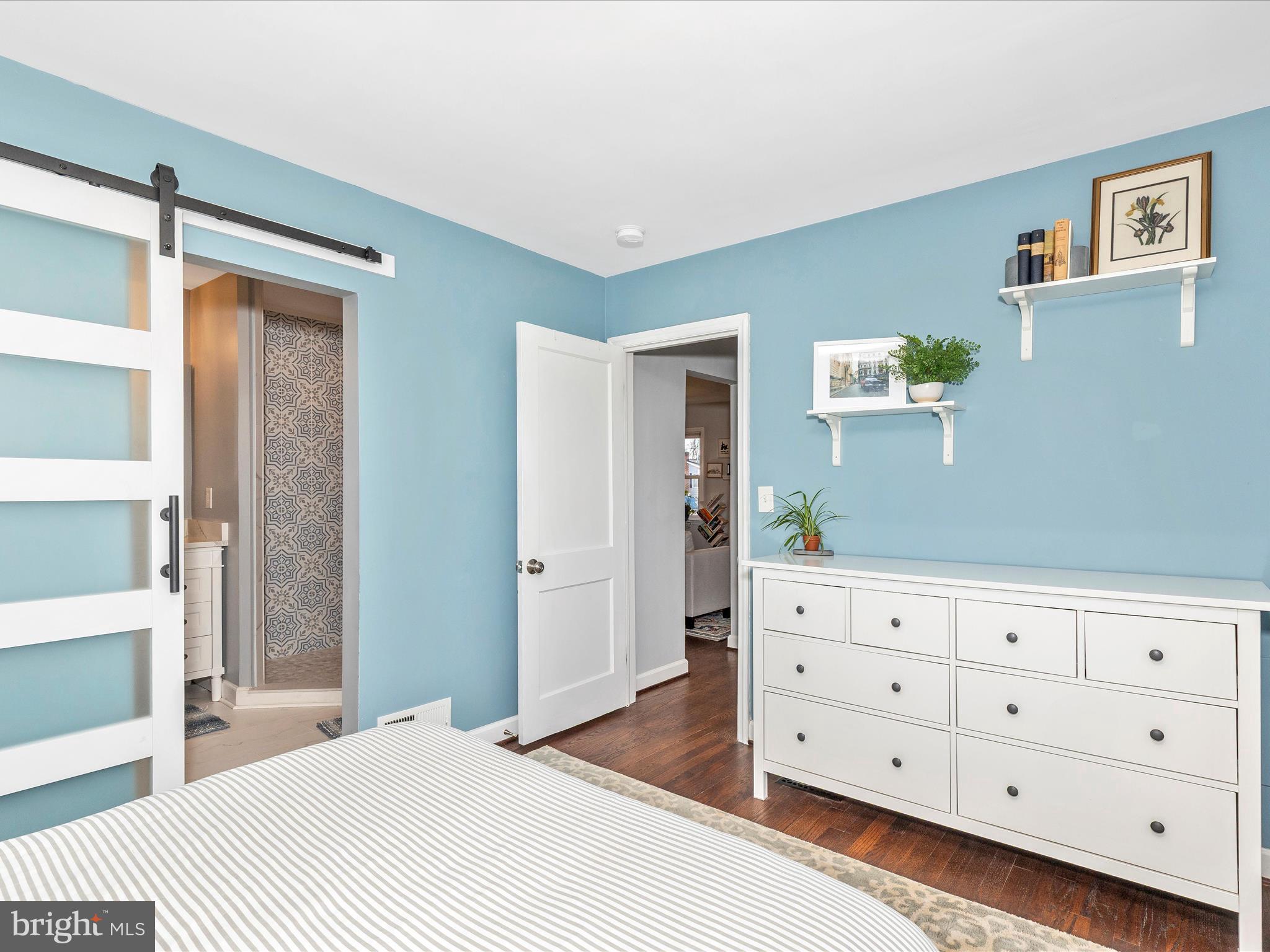 207 Thomas Avenue Frederick, MD 21701 - Photo 18 of 60 a bedroom with a bed and a dresser in it