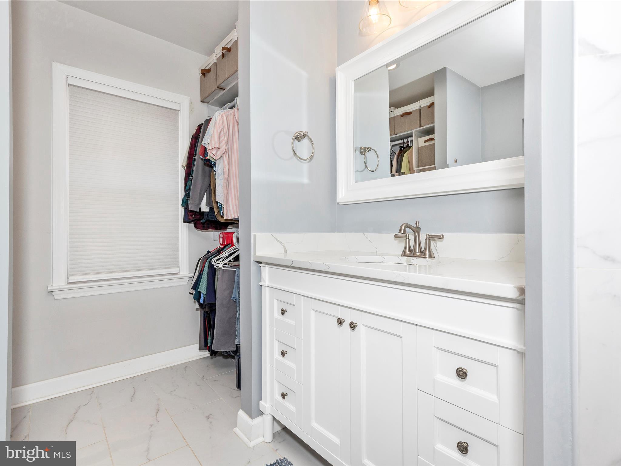 207 Thomas Avenue Frederick, MD 21701 - Photo 21 of 60 a bathroom with a sink vanity and a mirror