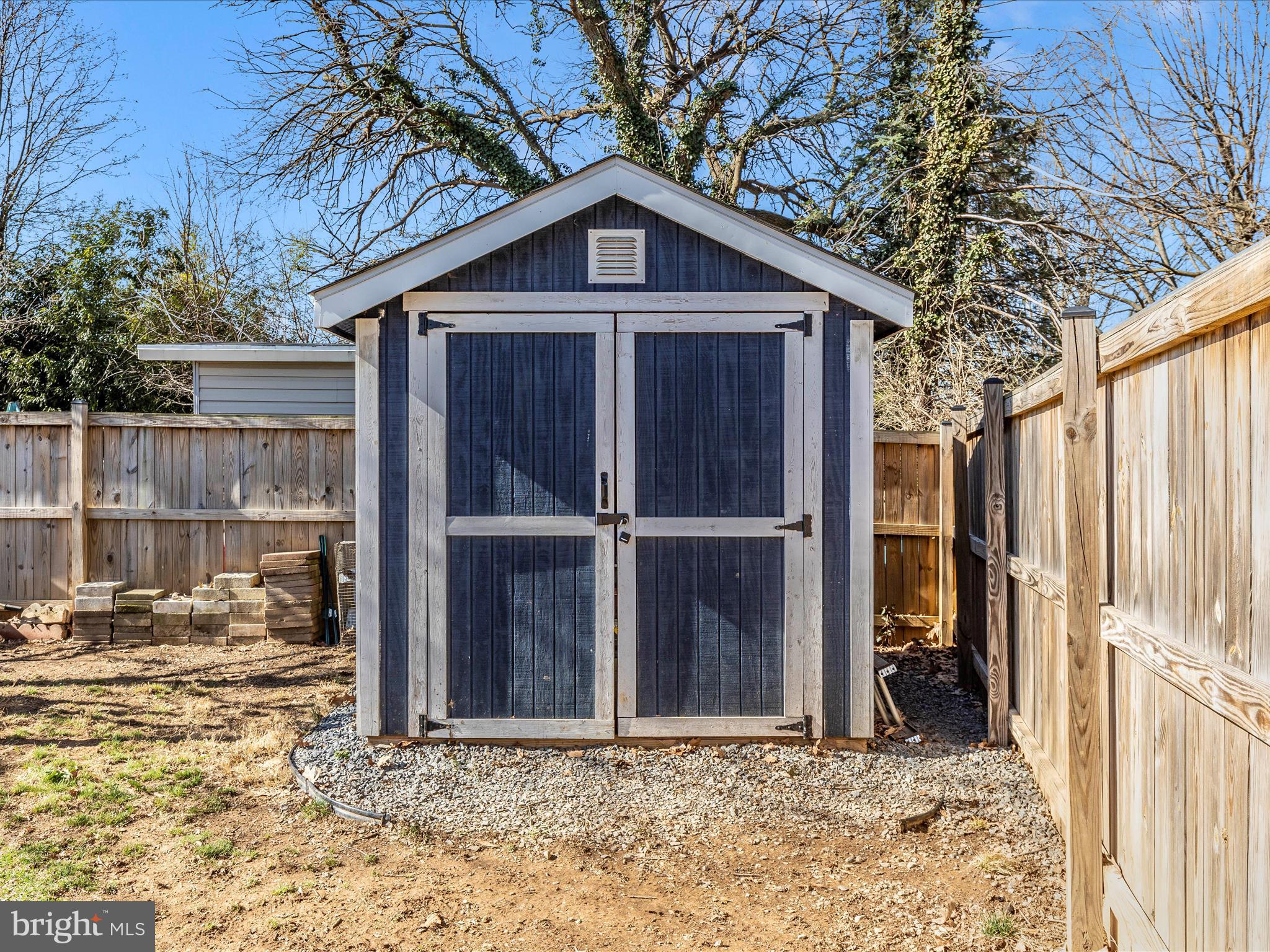 207 Thomas Avenue Frederick, MD 21701 - Photo 44 of 60 a view of a wooden house with a large window and wooden fence