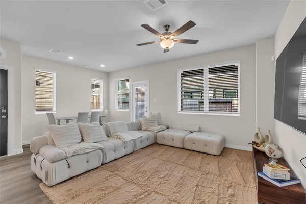 a living room with furniture and windows