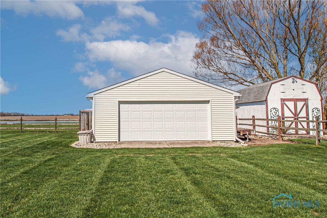 556 South Lathrop Road Swanton, OH 43558 - Photo 34 of 45 Hobbiest dream and more storage with this 24x24' garage makes for 4.5 car spaces in total.