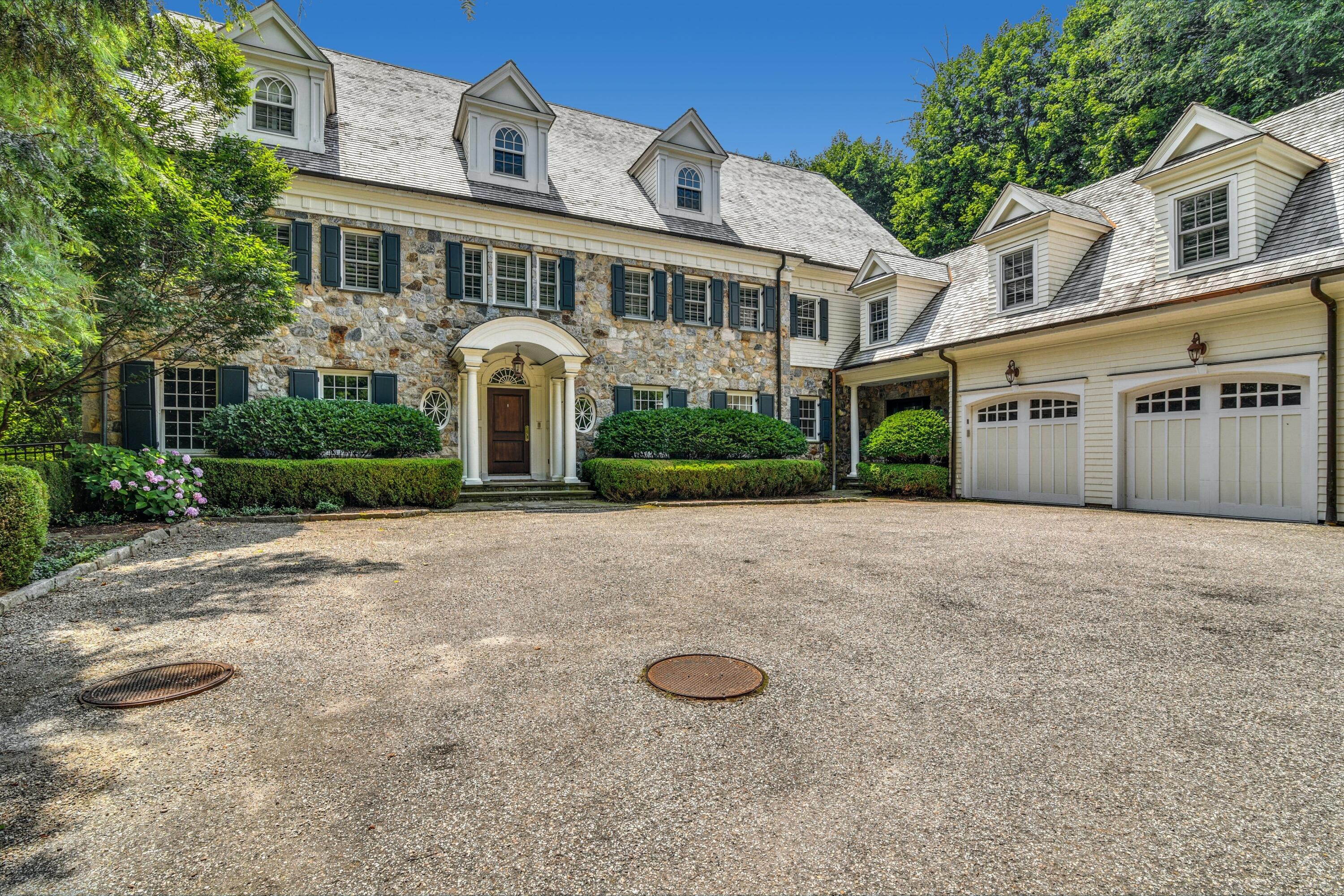 183 Ferris Hill Road New Canaan, CT 06840 - Photo 1 of 40 front view of a house with a yard