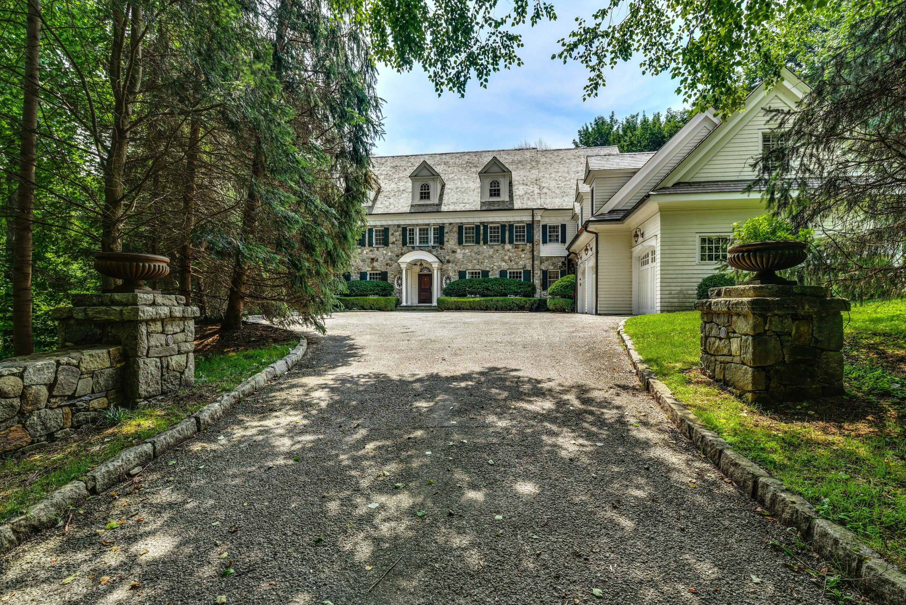 183 Ferris Hill Road New Canaan, CT 06840 - Photo 2 of 40 a view of a house with a yard