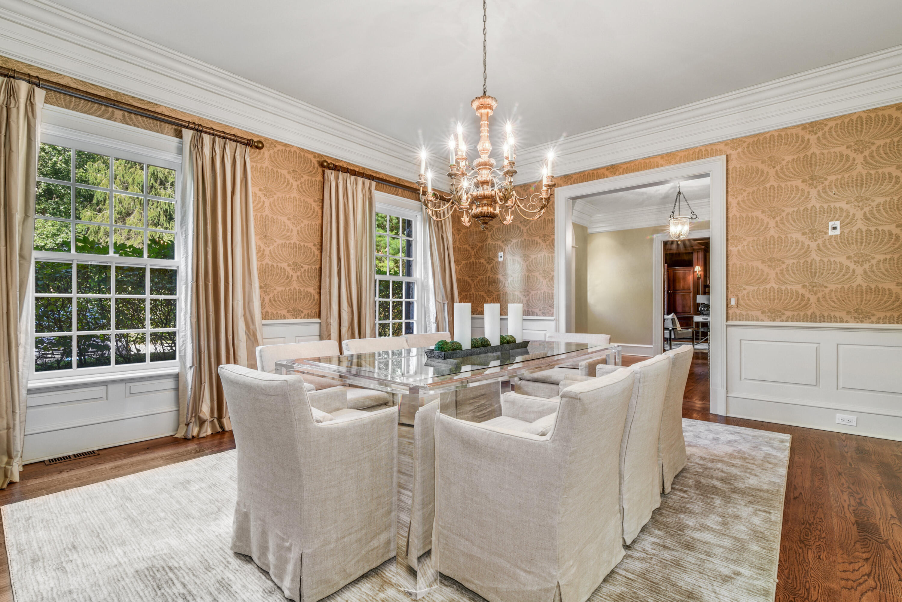 183 Ferris Hill Road New Canaan, CT 06840 - Photo 11 of 40 a dining room with furniture a chandelier and wooden floor