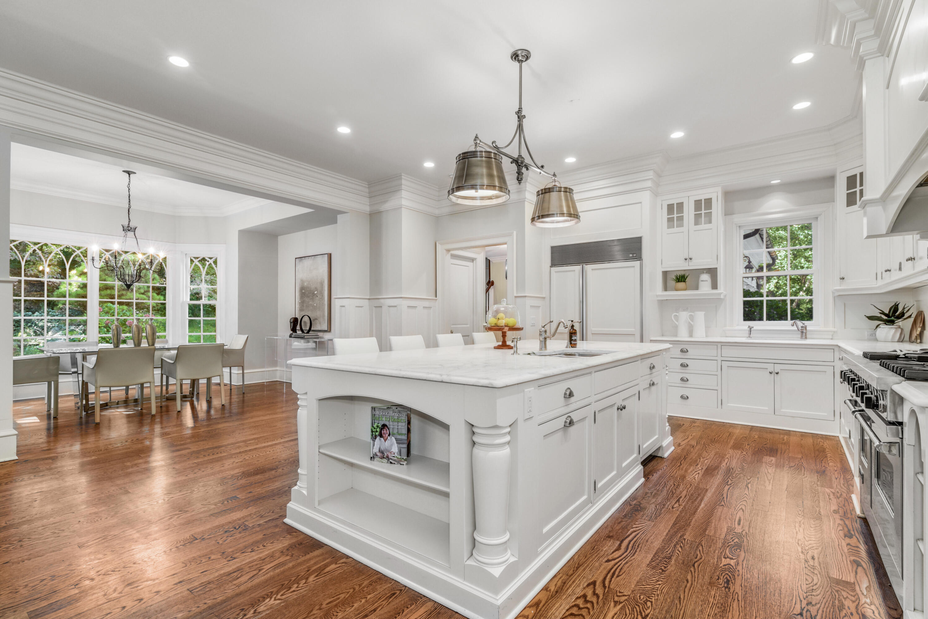 183 Ferris Hill Road New Canaan, CT 06840 - Photo 13 of 40 a large white kitchen with lots of counter space a sink appliances and living room view