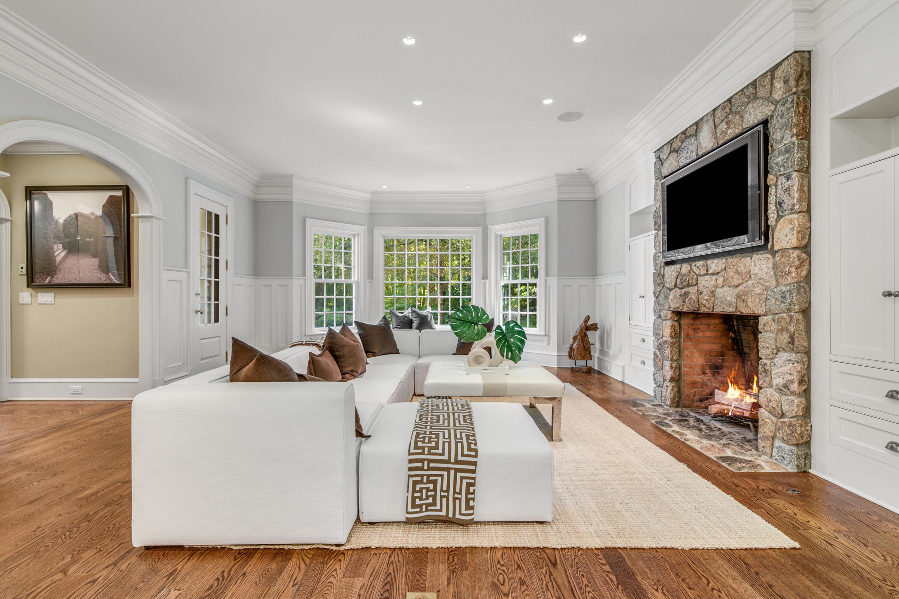 183 Ferris Hill Road New Canaan, CT 06840 - Photo 18 of 40 a living room with furniture fireplace and flat screen tv