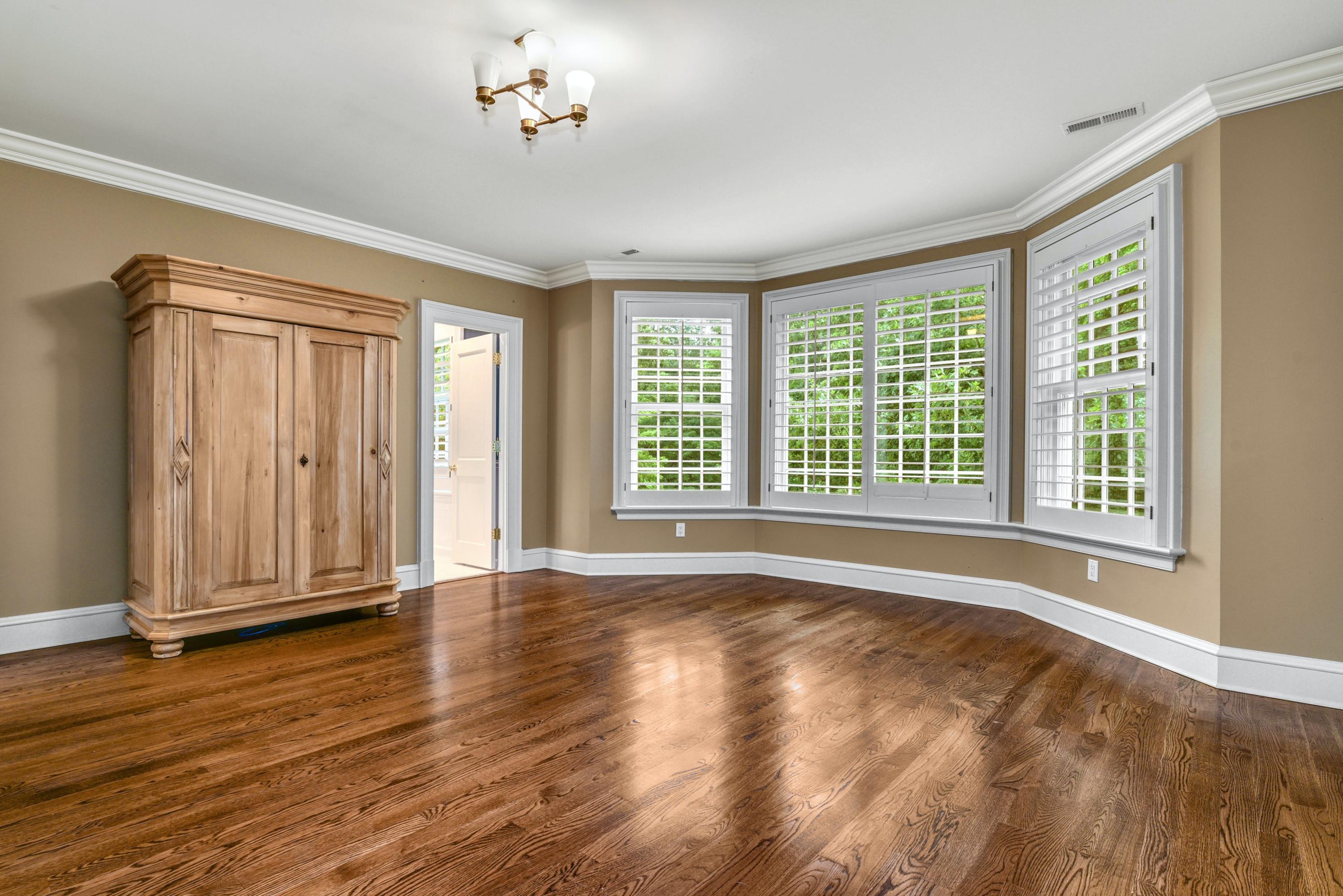 183 Ferris Hill Road New Canaan, CT 06840 - Photo 24 of 40 a view of an empty room with a window and wooden floor