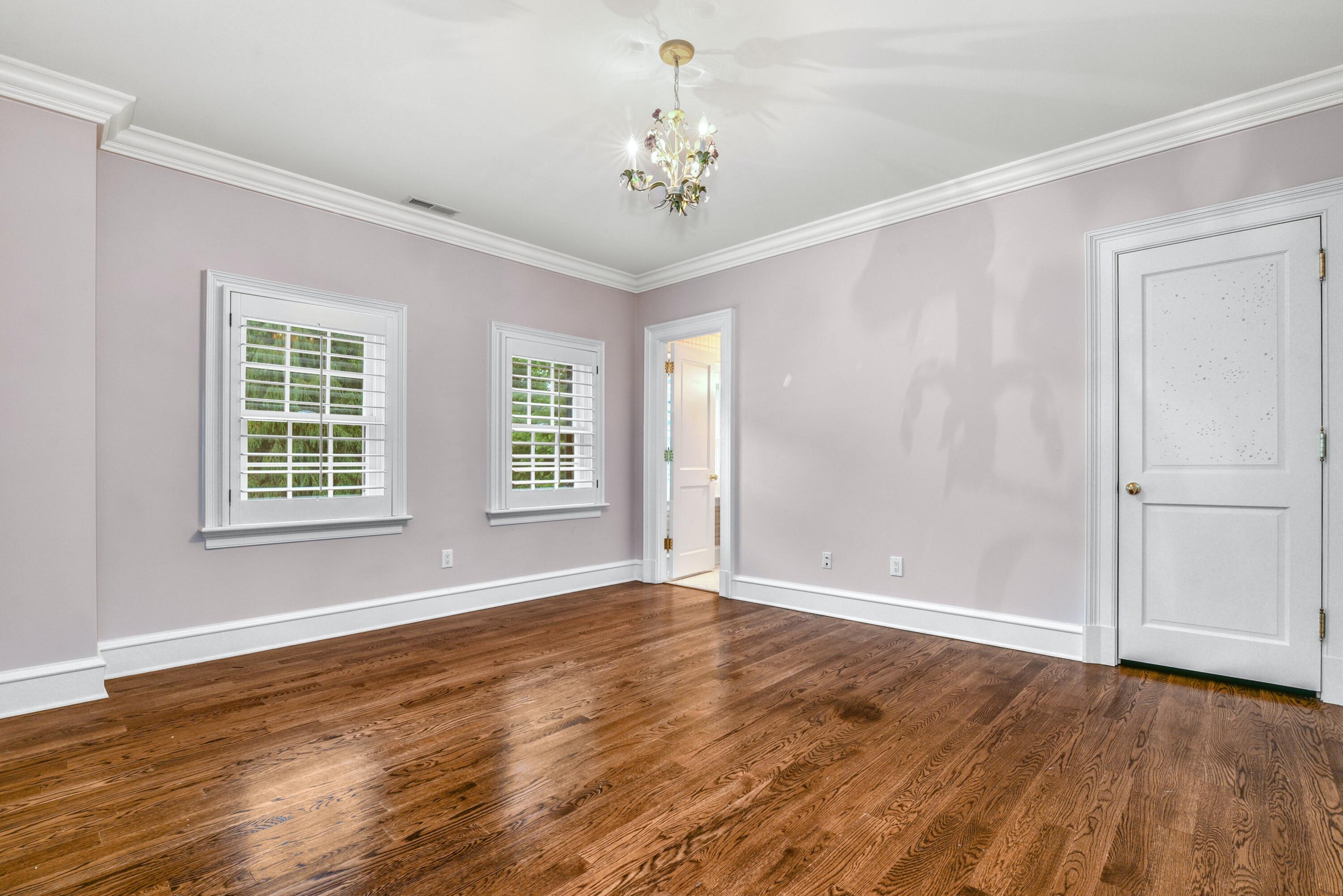 183 Ferris Hill Road New Canaan, CT 06840 - Photo 25 of 40 a view of an empty room with wooden floor and a window
