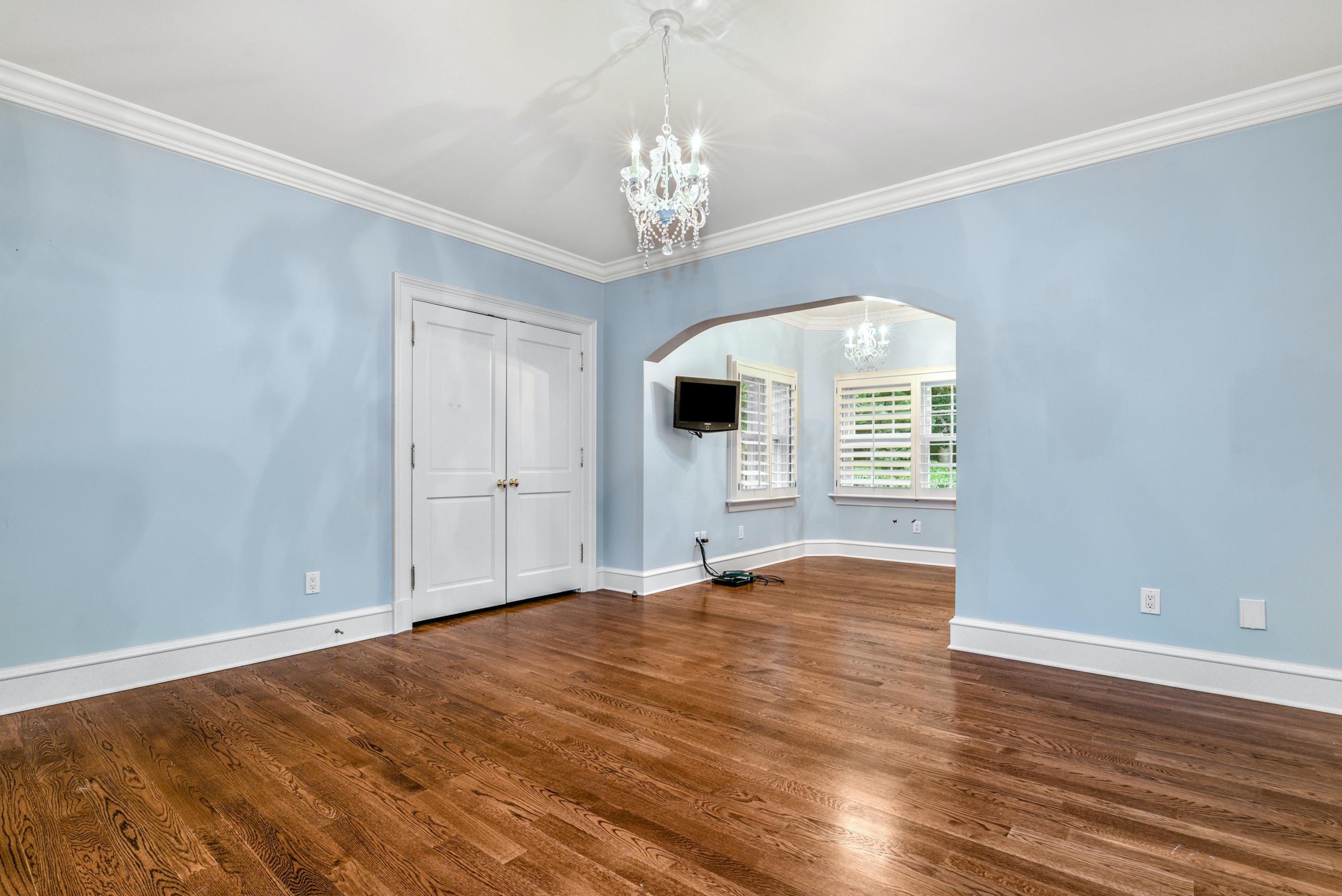 183 Ferris Hill Road New Canaan, CT 06840 - Photo 26 of 40 a view of an empty room with window and wooden floor