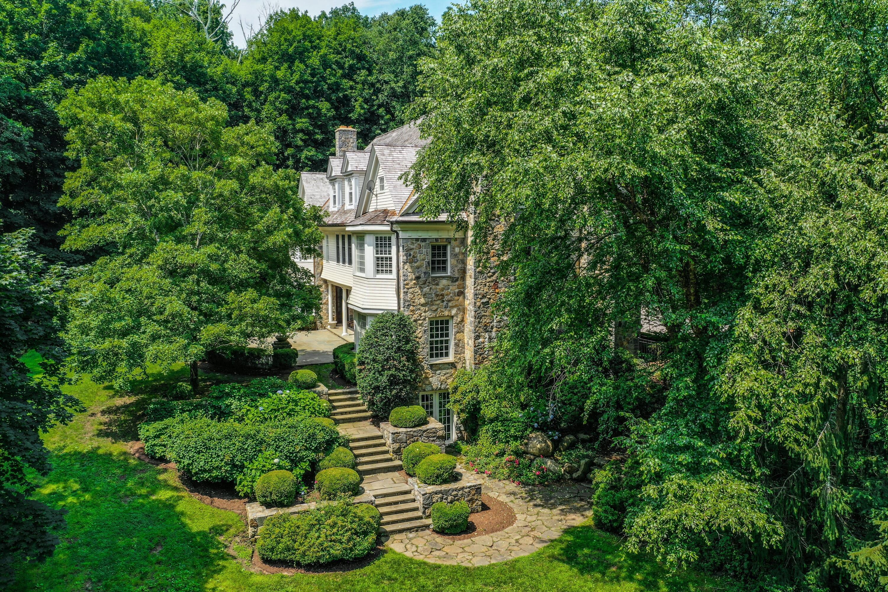 183 Ferris Hill Road New Canaan, CT 06840 - Photo 32 of 40 front view of a house with a yard