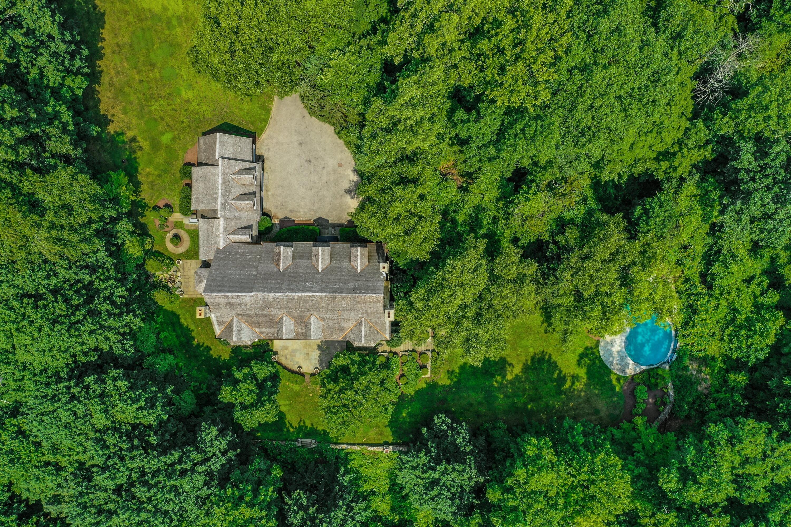 183 Ferris Hill Road New Canaan, CT 06840 - Photo 5 of 40 an aerial view of a house with a yard and large tree