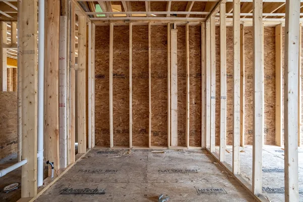 a view of a room with wooden walls