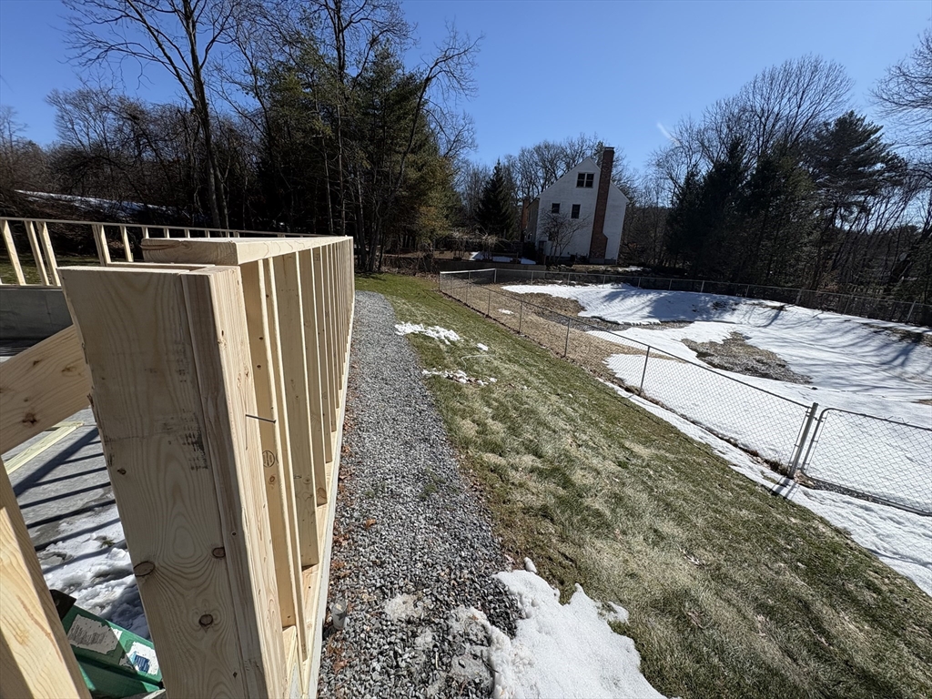 48 Jewell Road, Unit LOT 6 Marlborough, MA 01752 - Photo 29 of 35 a view of a backyard with a trees