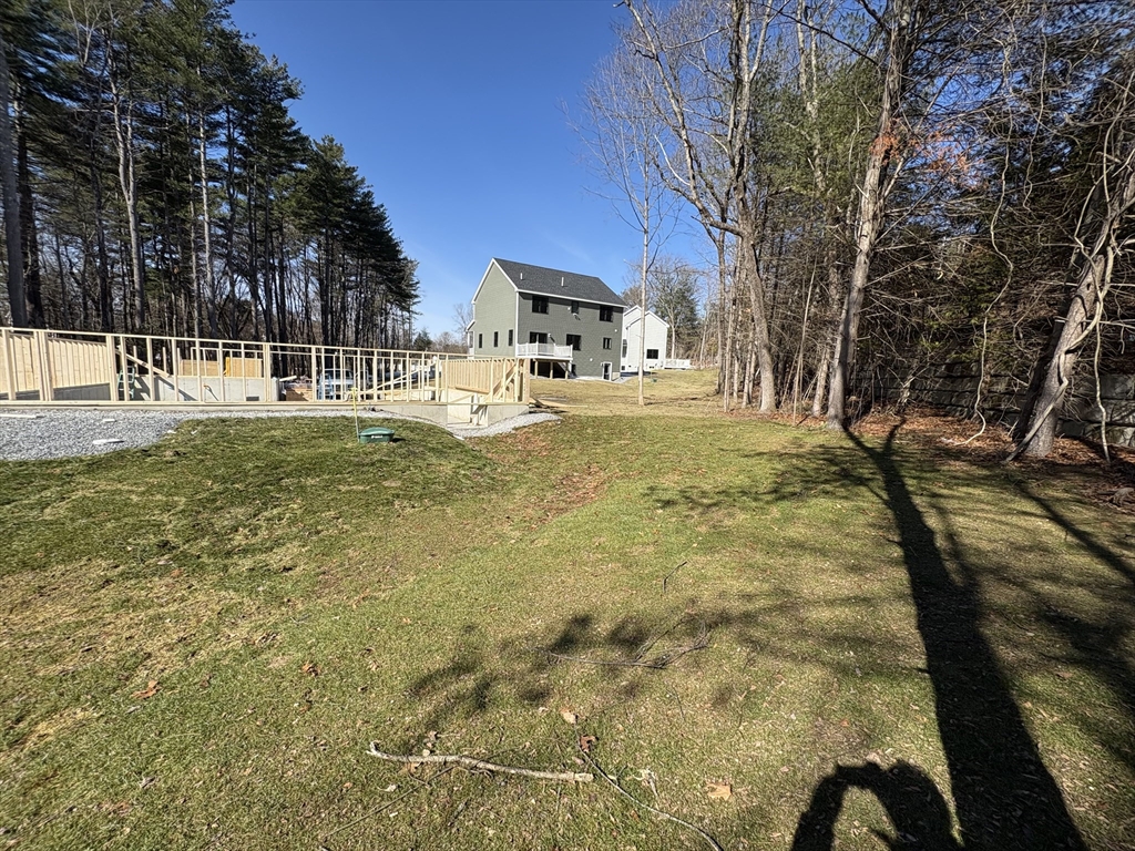 48 Jewell Road, Unit LOT 6 Marlborough, MA 01752 - Photo 32 of 35 a view of a yard with yellow house