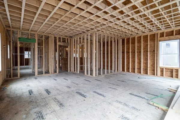 a view of an empty room with windows