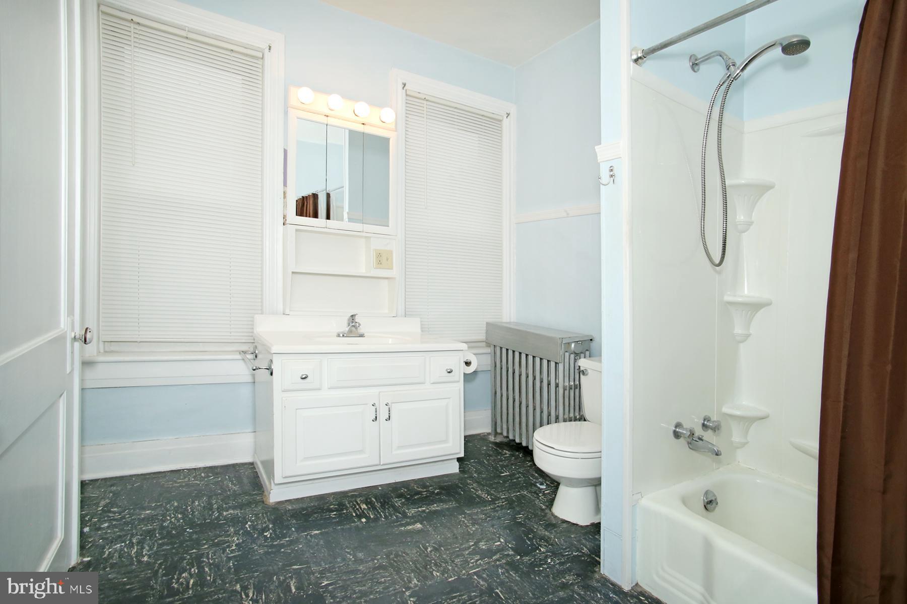 133 West Market Street Jonestown, PA 17038 - Photo 14 of 43 a bathroom with a granite countertop sink a toilet and shower