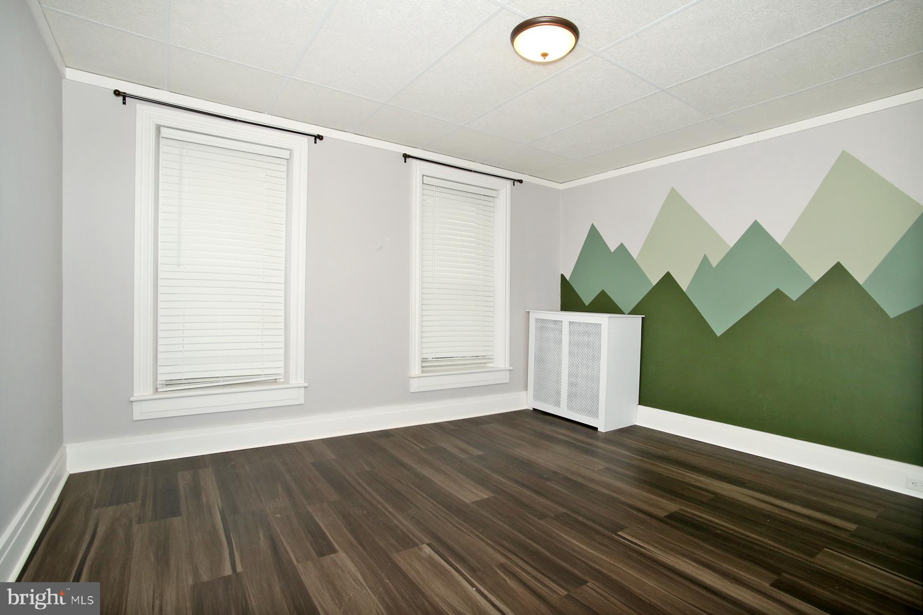 133 West Market Street Jonestown, PA 17038 - Photo 17 of 43 a view of an empty room with wooden floor and a window