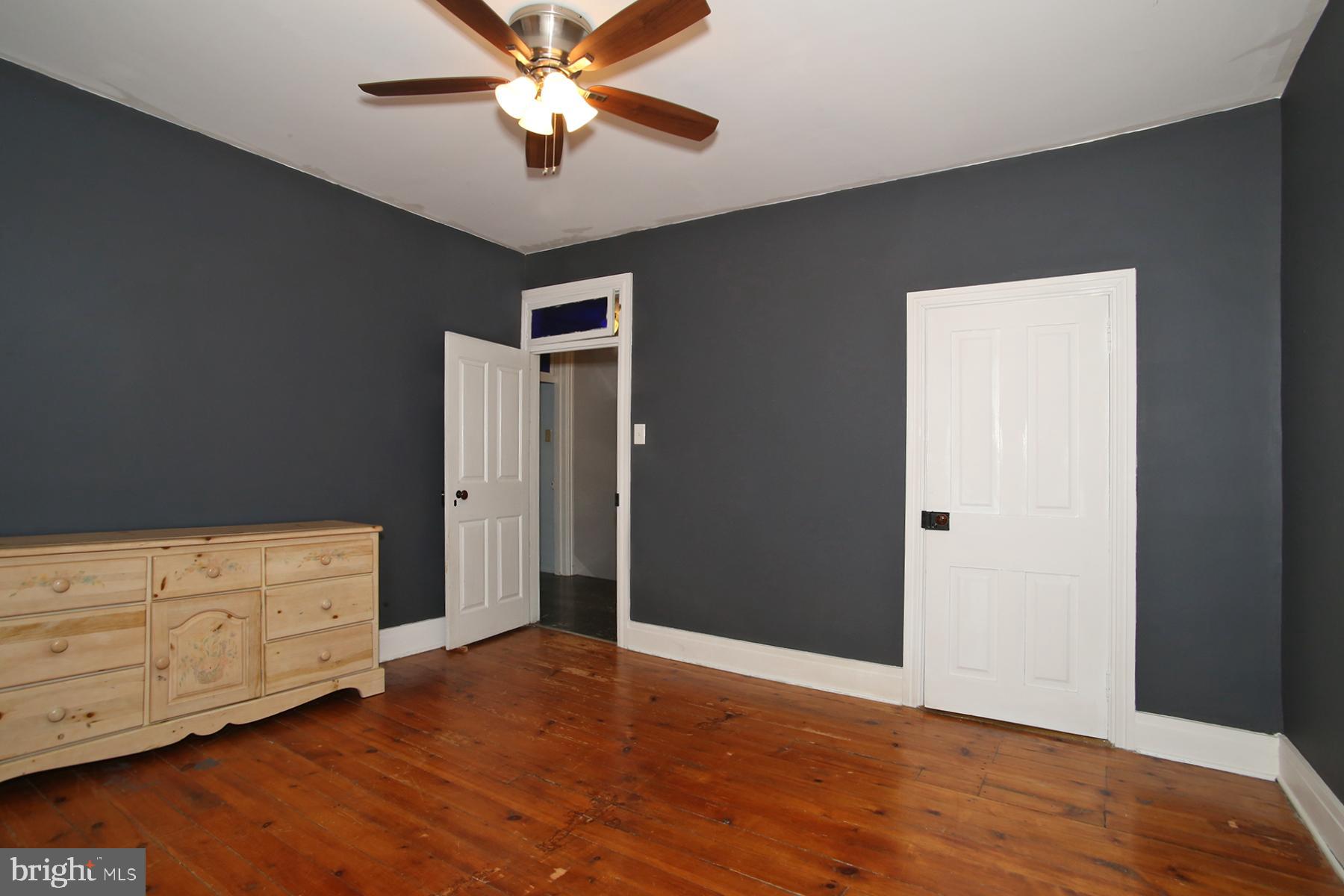 133 West Market Street Jonestown, PA 17038 - Photo 22 of 43 a view of an empty room with wooden floor and a ceiling fan