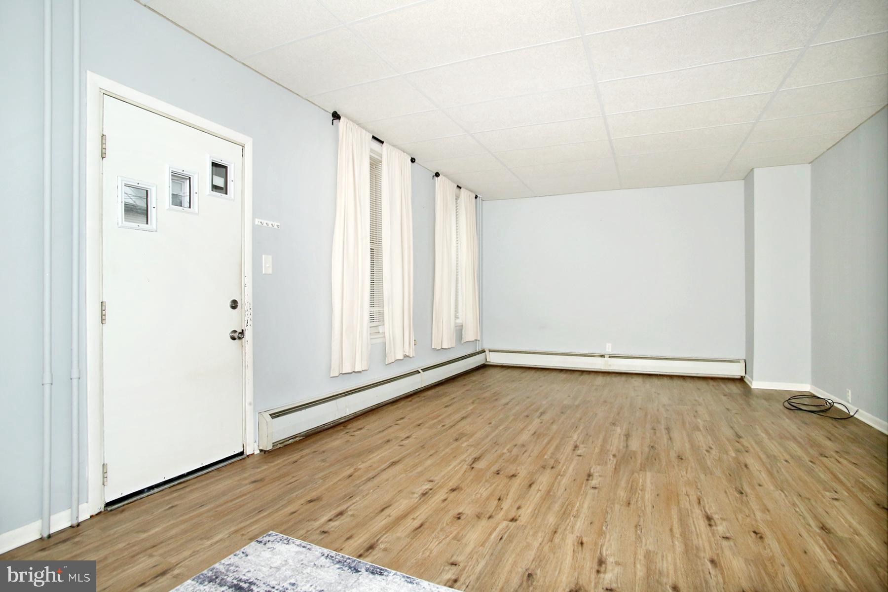 133 West Market Street Jonestown, PA 17038 - Photo 4 of 43 a view of an empty room with wooden floor