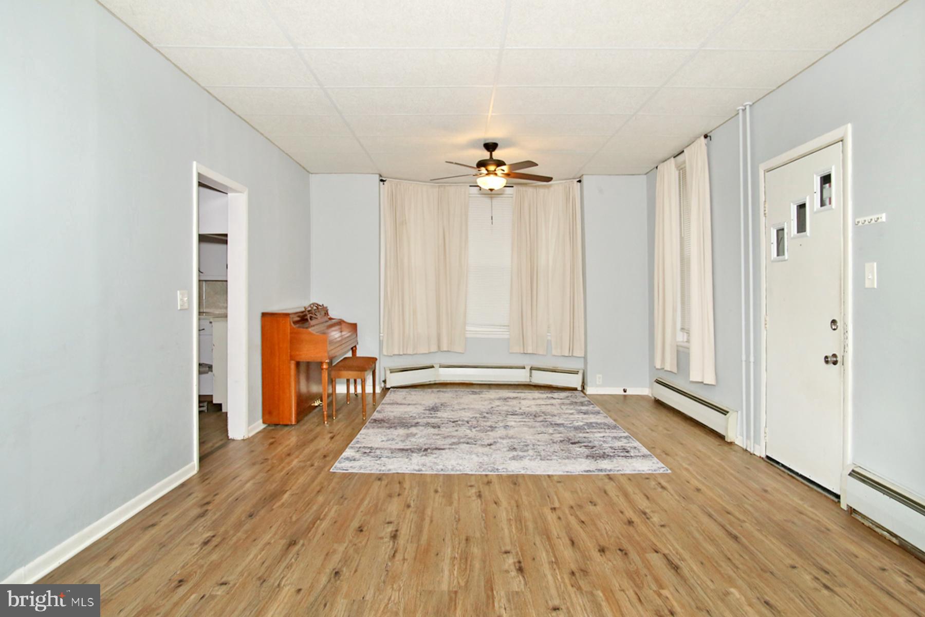 133 West Market Street Jonestown, PA 17038 - Photo 5 of 43 a view of a livingroom with a hardwood floor and a ceiling fan