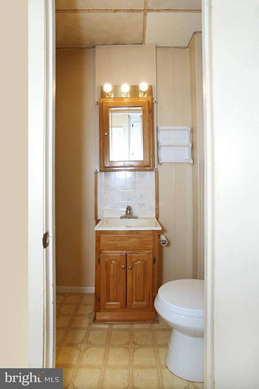 133 West Market Street Jonestown, PA 17038 - Photo 9 of 43 a bathroom with a sink a toilet and mirror