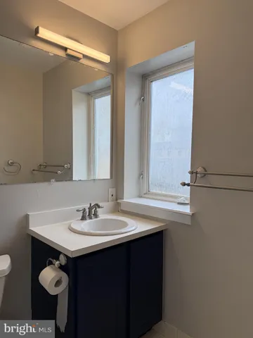 a sink with a mirror